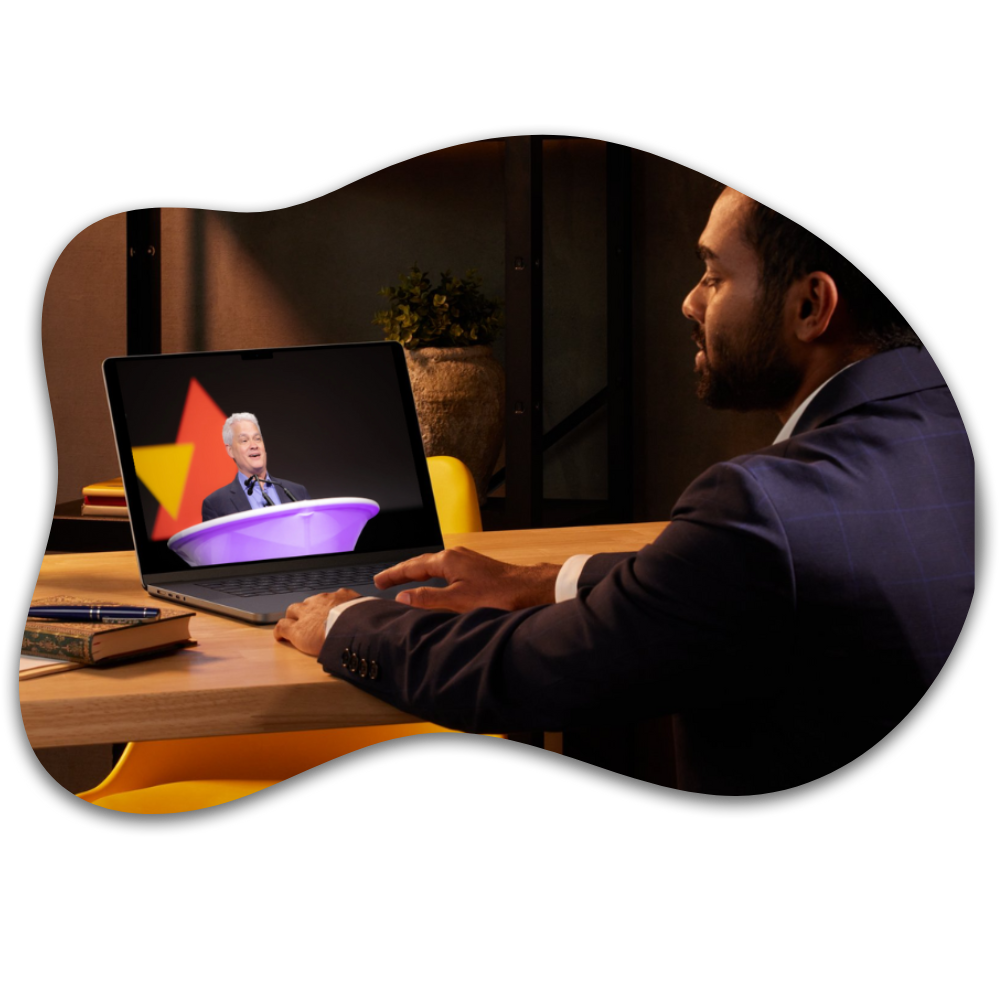 person watching conference on a laptop