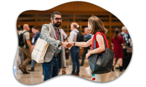 2 attendees shaking hands