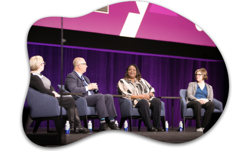 Panel of people on a stage