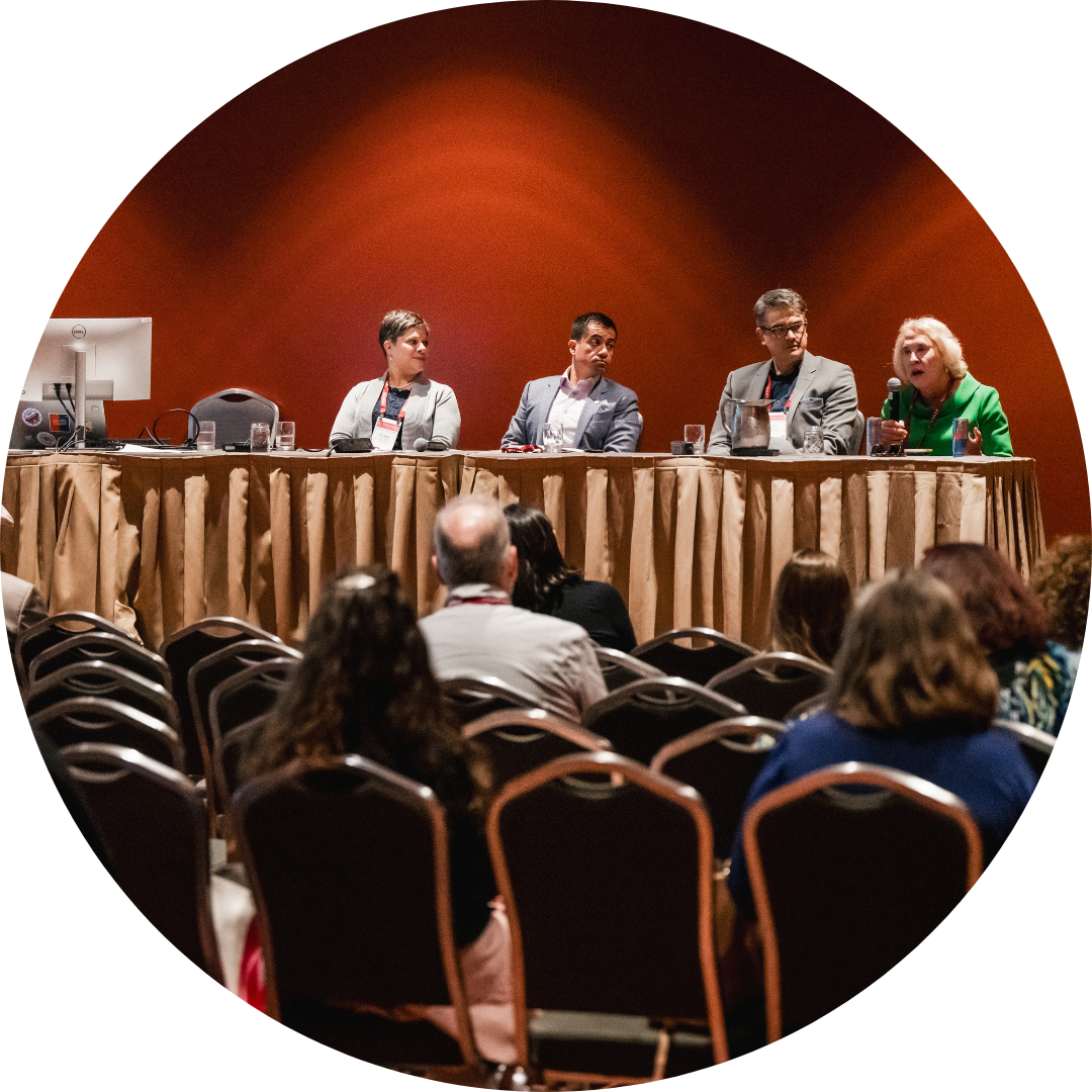 icon: panel of people on stage