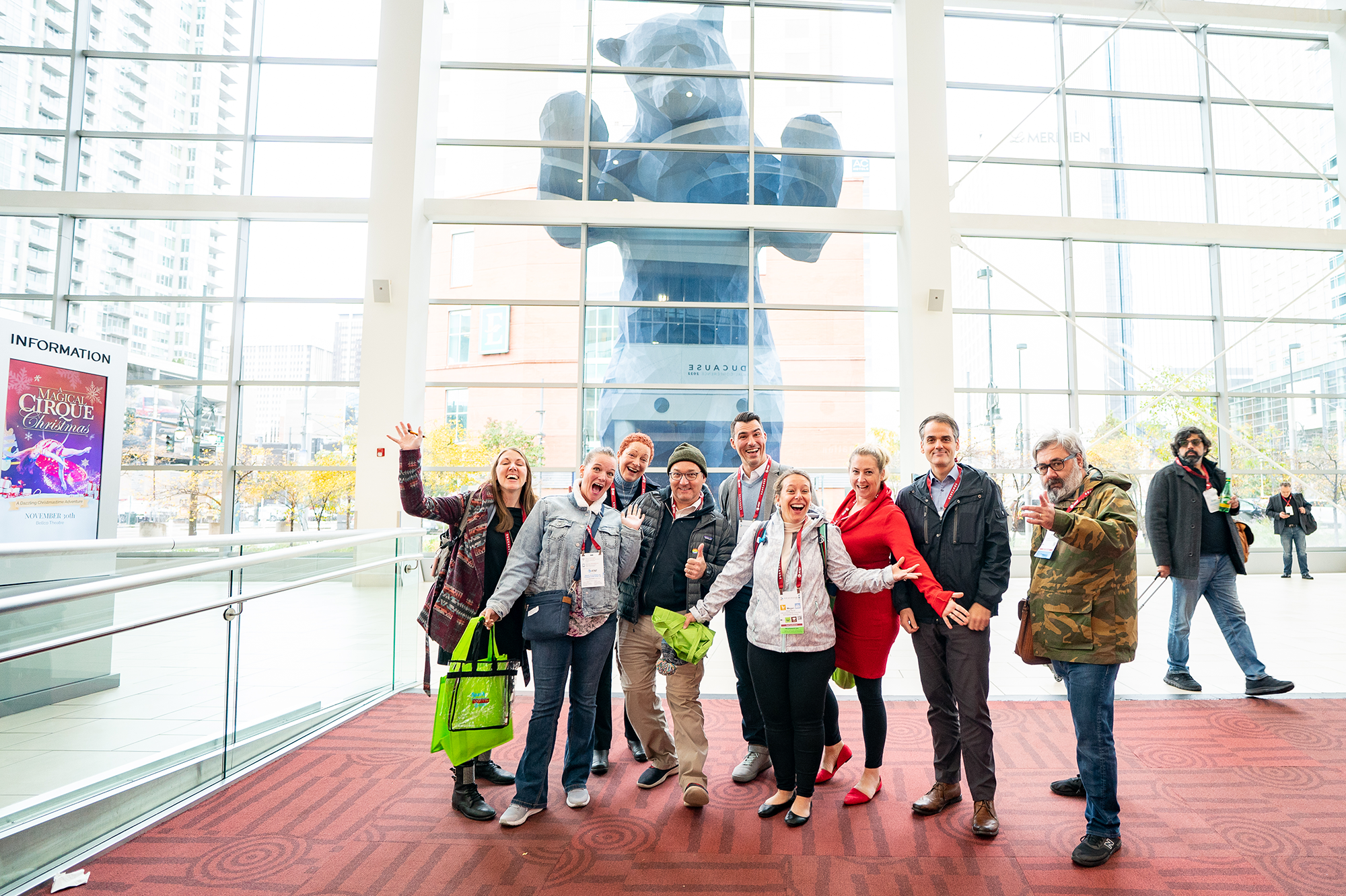 Group standing in the Convention Center in front of the Blue Bear