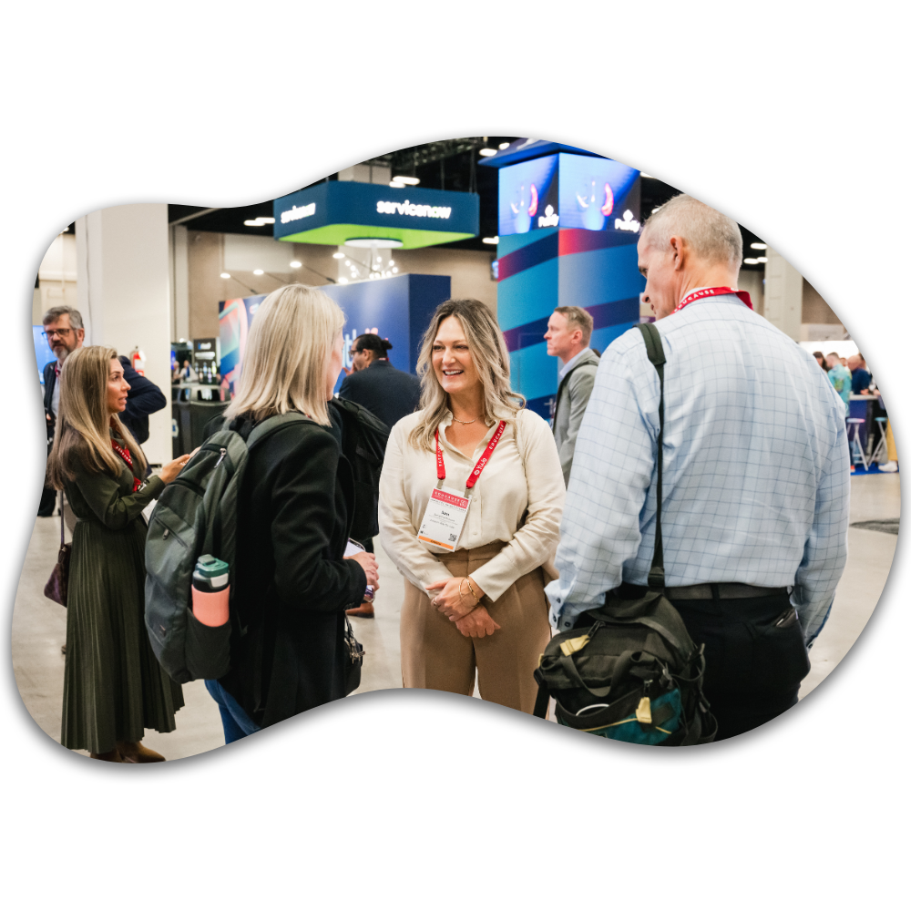 3 people talking in the exhibit hall